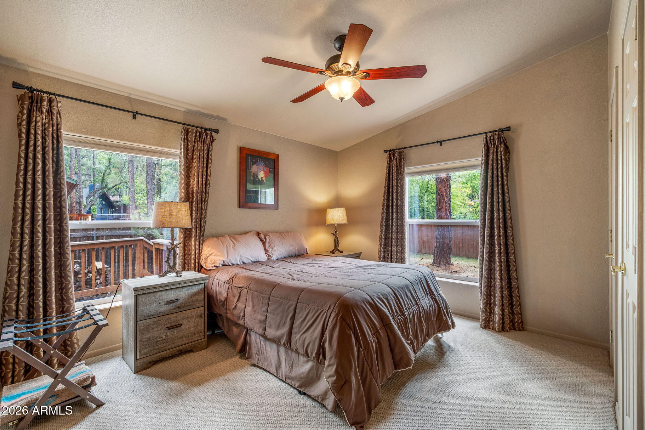 758 Southlake Road Lakeside, AZ 85929 - Photo 70 of 95 a bedroom with a bed and a large window with the outer view