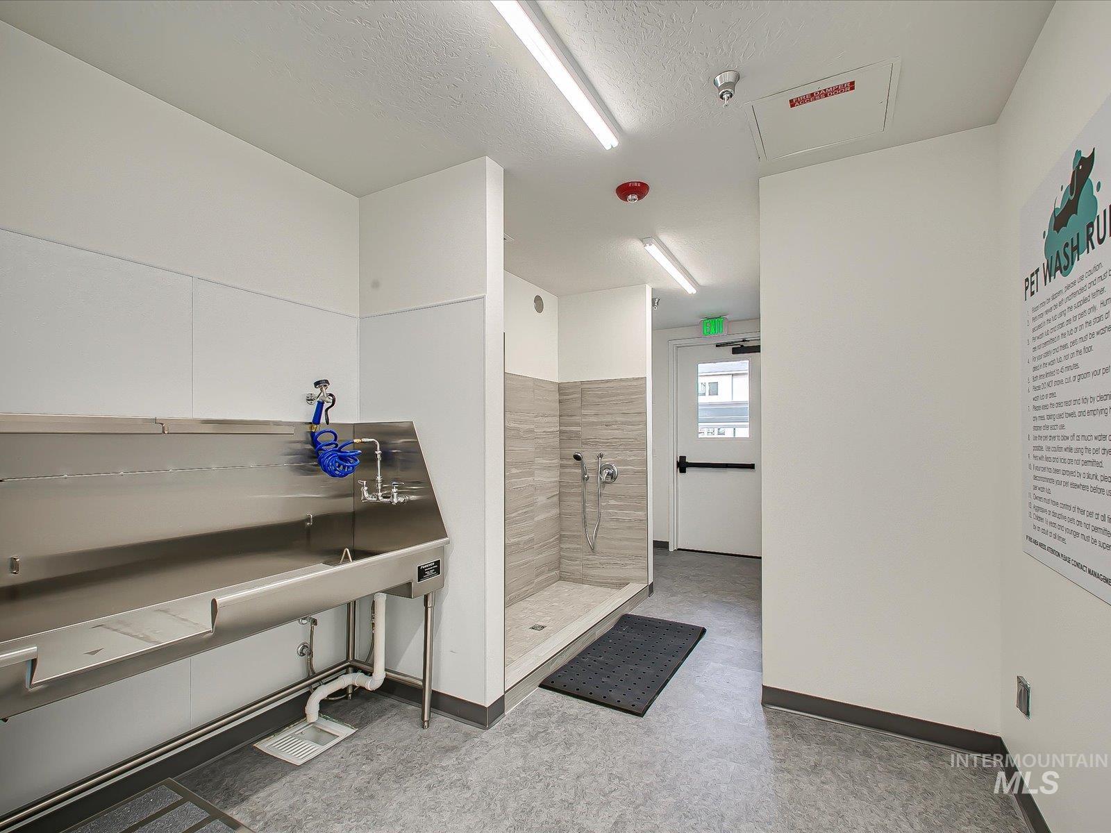 3850 East Haystack Street, Unit 302 Boise, ID 83716 - Photo 26 of 47 Full bath with a shower stall and a textured ceiling