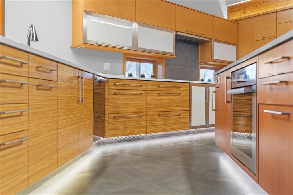 999 Elmhurst Road Pittsburgh, PA 15215 - Photo 11 of 49 Toe kick lighting light up the kitchen and the central vac makes for easy clean ups.