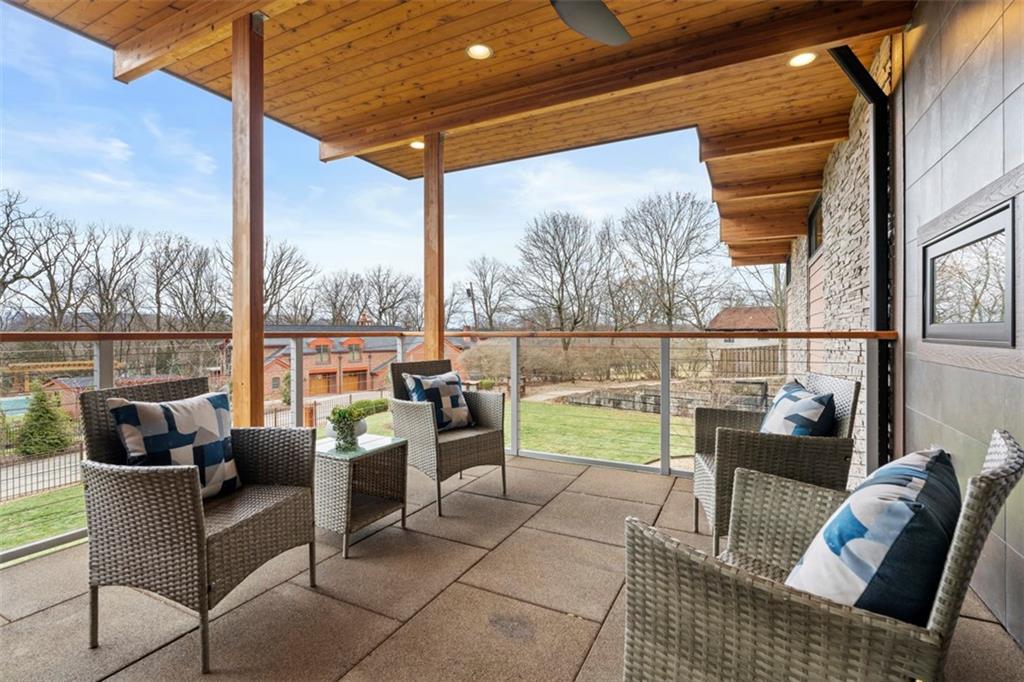 999 Elmhurst Road Pittsburgh, PA 15215 - Photo 19 of 49 The covered porch is a great spot to watch the sunset and is easily accessible from the kitchen and sunroom.