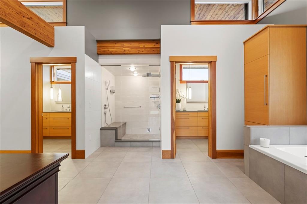 999 Elmhurst Road Pittsburgh, PA 15215 - Photo 23 of 49 The primary bathroom features his and her powder rooms and a luxurious steam shower.