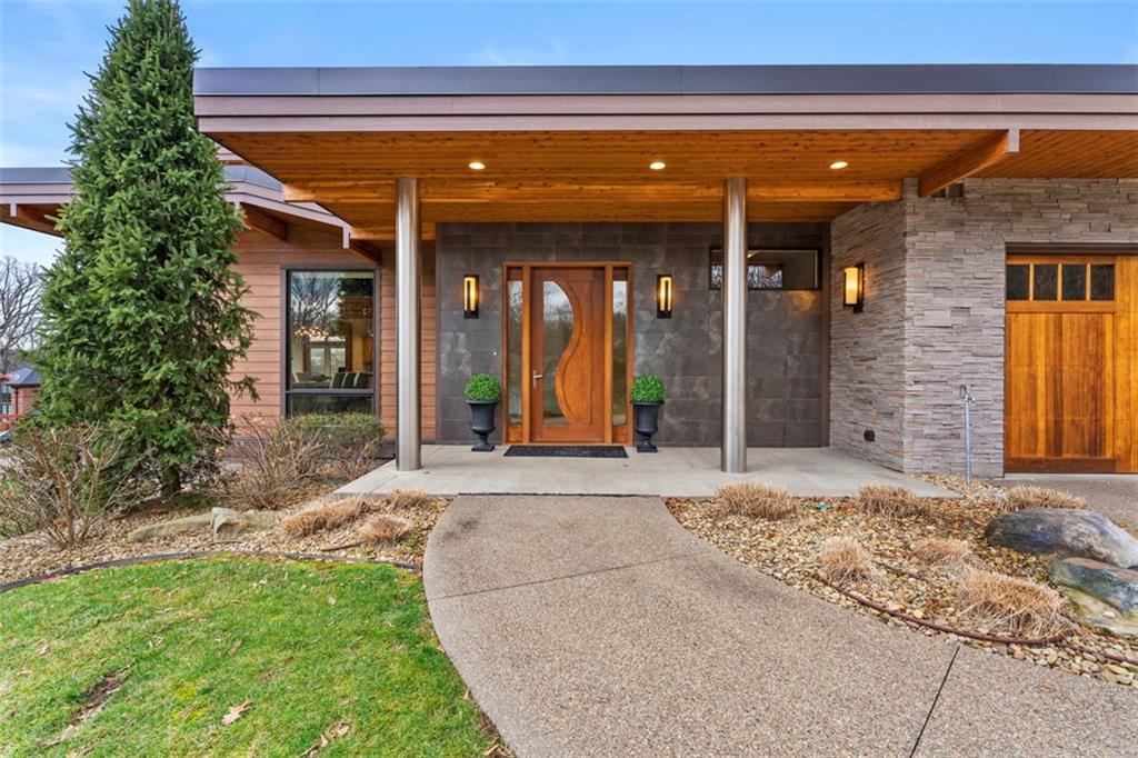 999 Elmhurst Road Pittsburgh, PA 15215 - Photo 3 of 49 The custom mahogany door is flanked by titanium pillars.