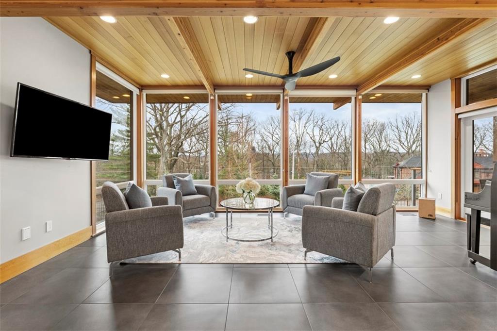 999 Elmhurst Road Pittsburgh, PA 15215 - Photo 7 of 49 The light filled sun room is a great gathering spot or can be used for additional dining area.