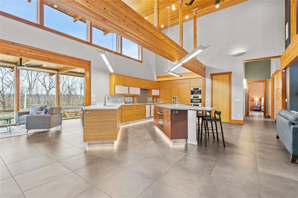 999 Elmhurst Road Pittsburgh, PA 15215 - Photo 10 of 49 The custom Curve kitchen is the center of the home and features under cabinet lighting, Miele appliances, built in espresso bar, a walk in pantry and easy pass through windows to the covered porch.