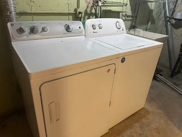 a street sign on a brick wall