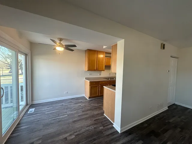 a view of a kitchen cabinets and wooden floor