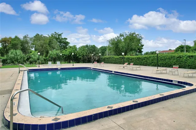 a view of swimming pool from a balcony
