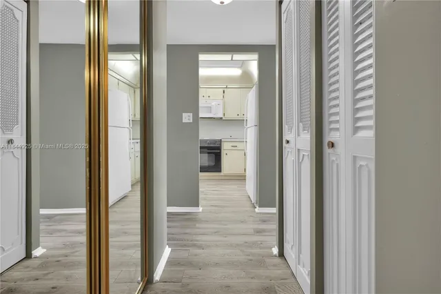 a kitchen with a stove oven and a refrigerator