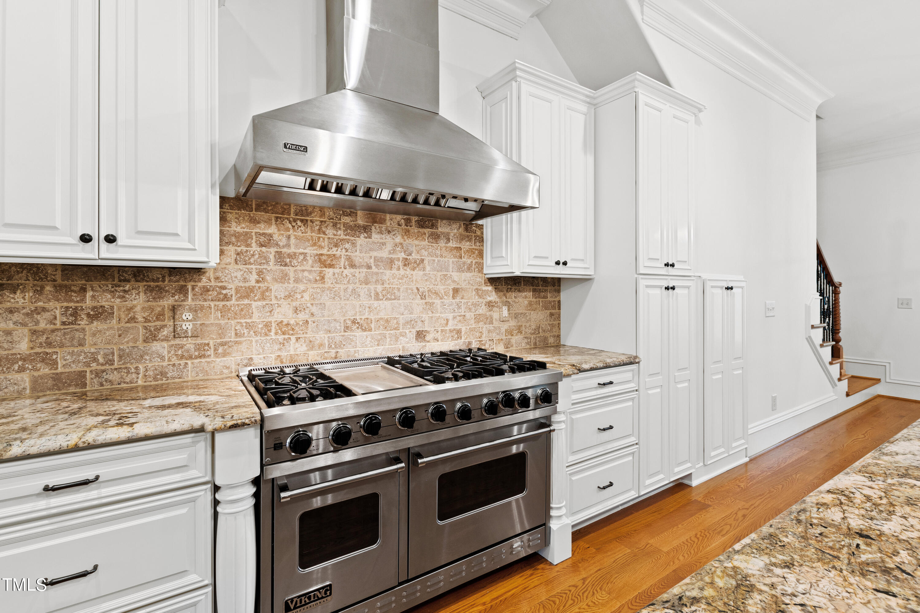 8108 Harps Mill Road Raleigh, NC 27615 - Photo 15 of 64 a kitchen with stainless steel appliances granite countertop a stove and a white wooden cabinets