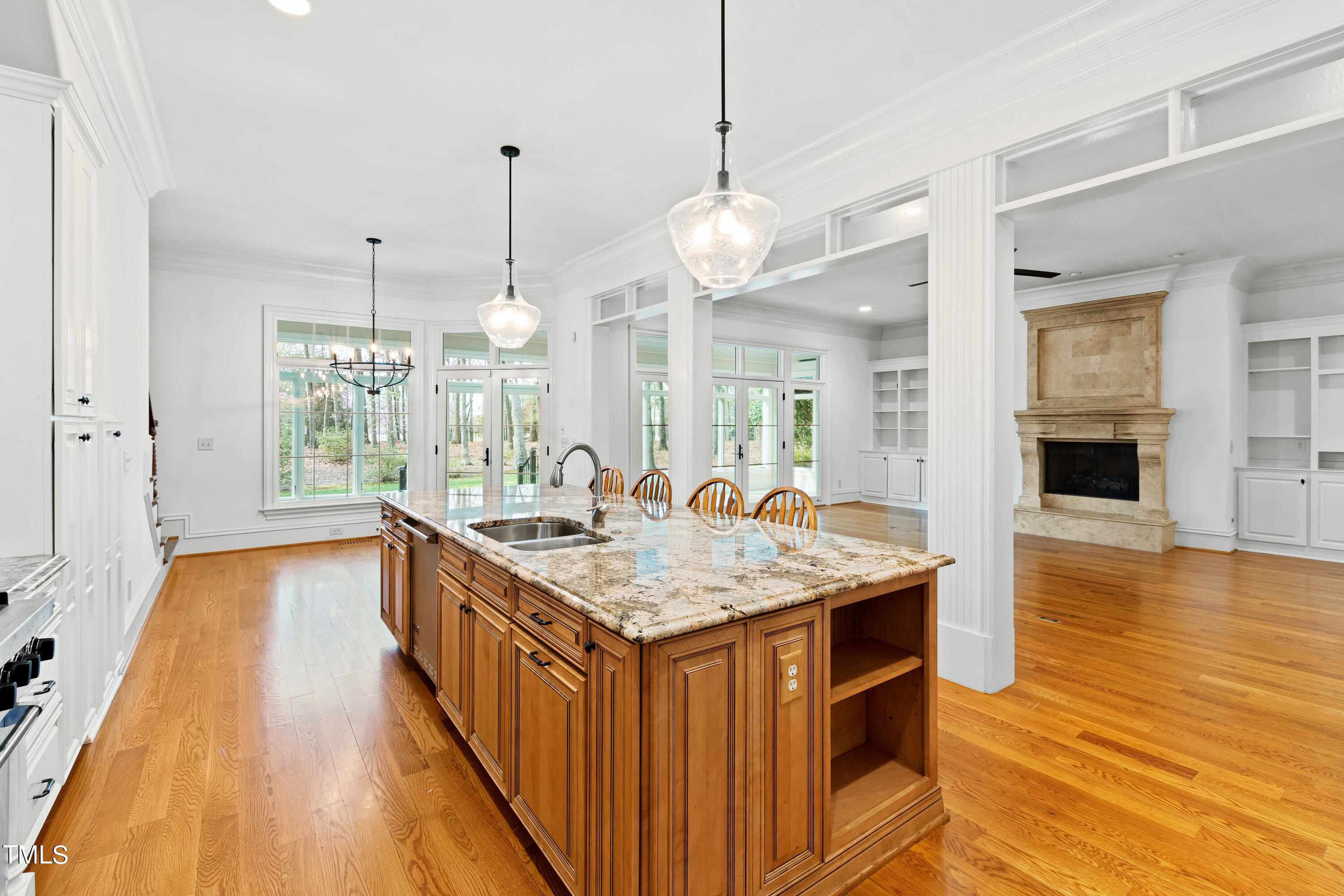 8108 Harps Mill Road Raleigh, NC 27615 - Photo 16 of 64 a kitchen with kitchen island a large island in the center and stainless steel appliances