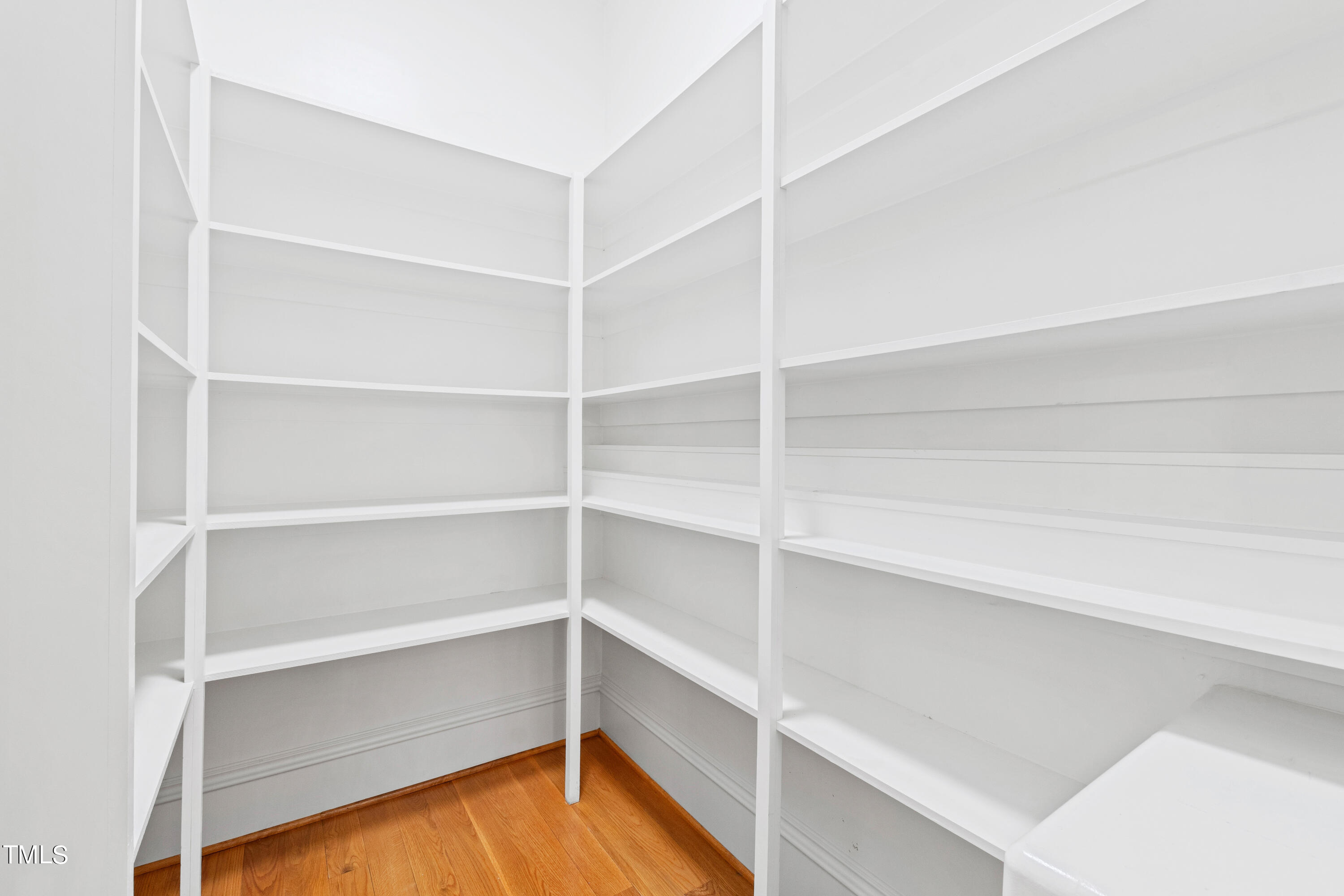 8108 Harps Mill Road Raleigh, NC 27615 - Photo 20 of 64 a view of walk in closet with empty racks