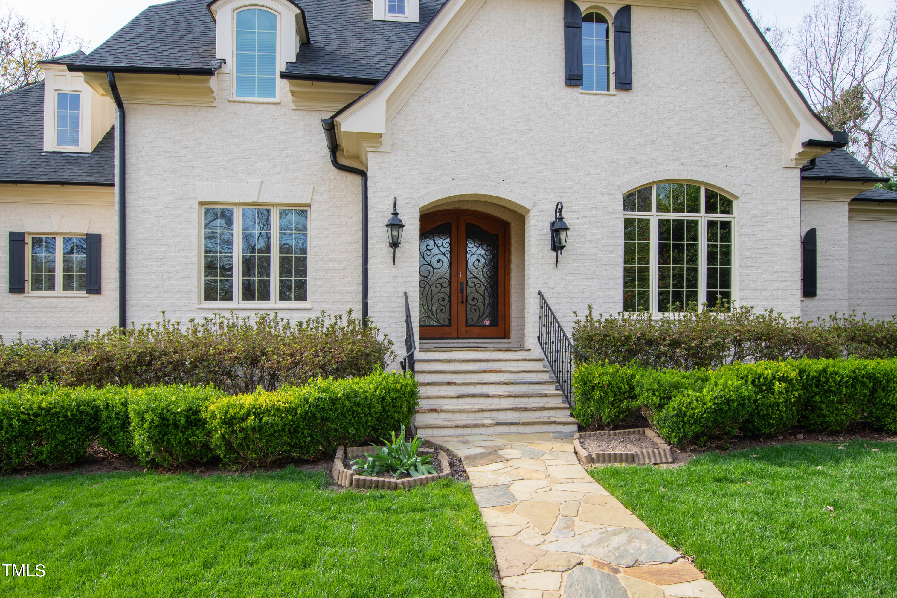 8108 Harps Mill Road Raleigh, NC 27615 - Photo 2 of 64 a front view of a house with garden