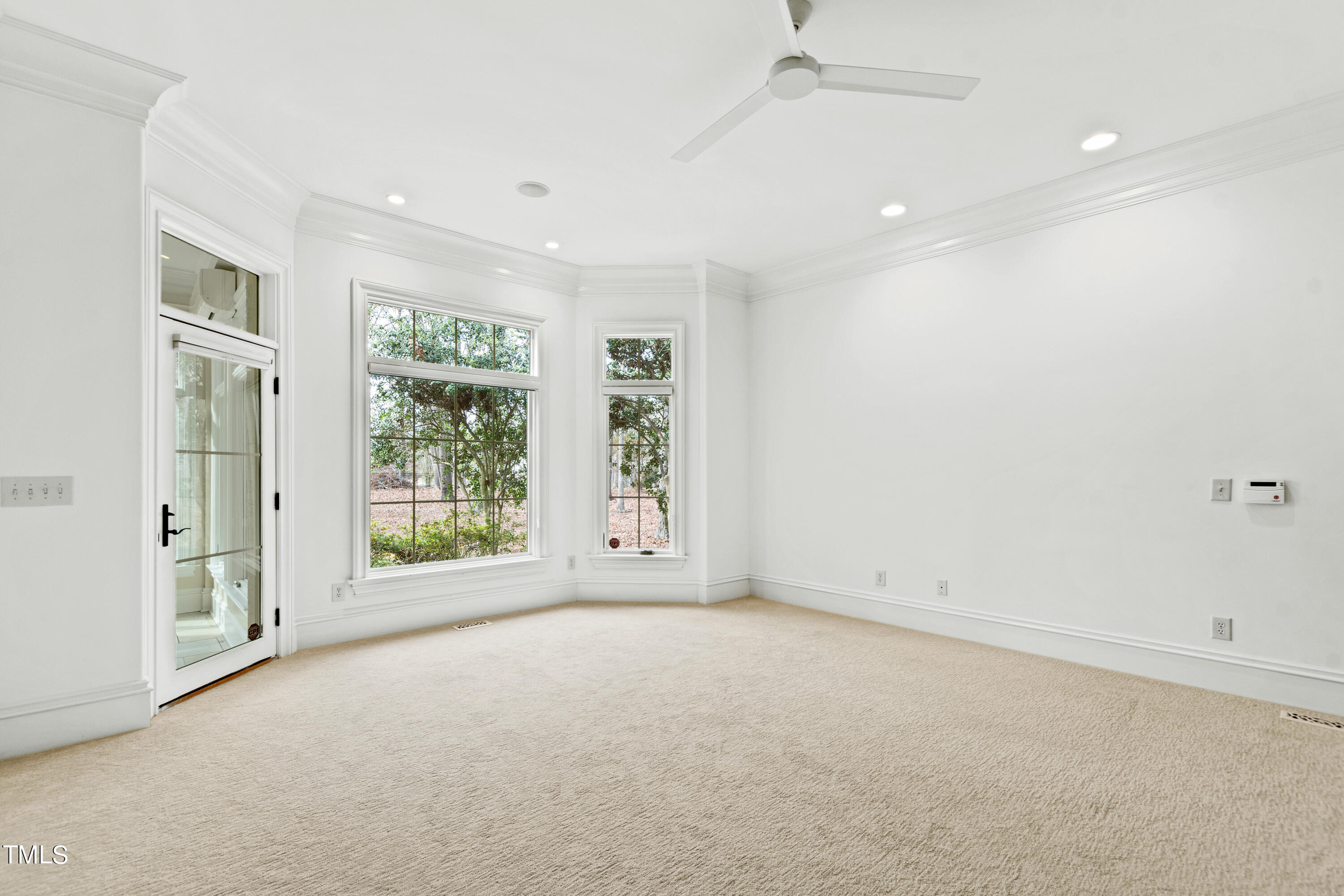 8108 Harps Mill Road Raleigh, NC 27615 - Photo 29 of 64 an empty room with windows