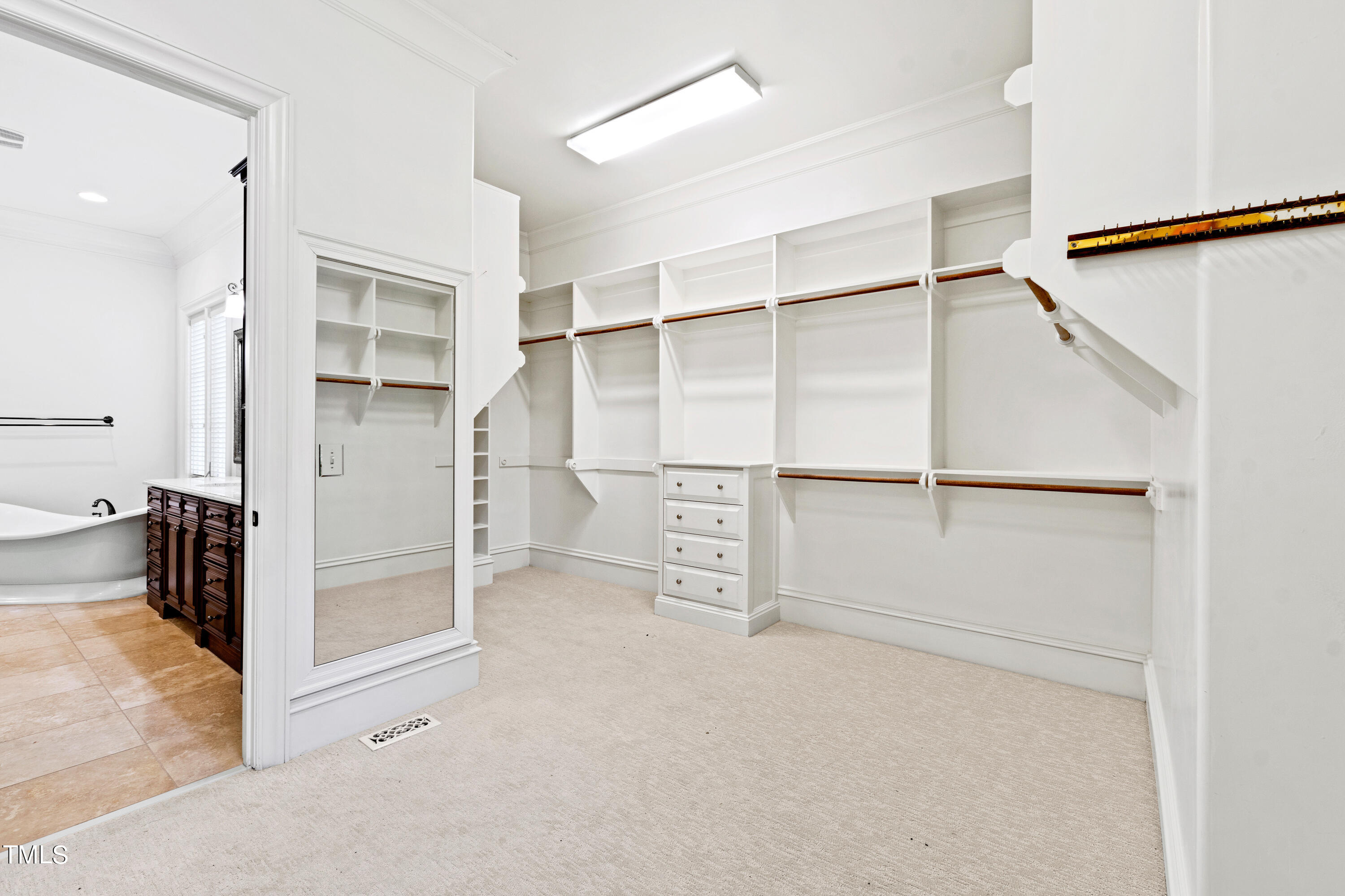 8108 Harps Mill Road Raleigh, NC 27615 - Photo 35 of 64 an empty room with closet and a ceiling fan
