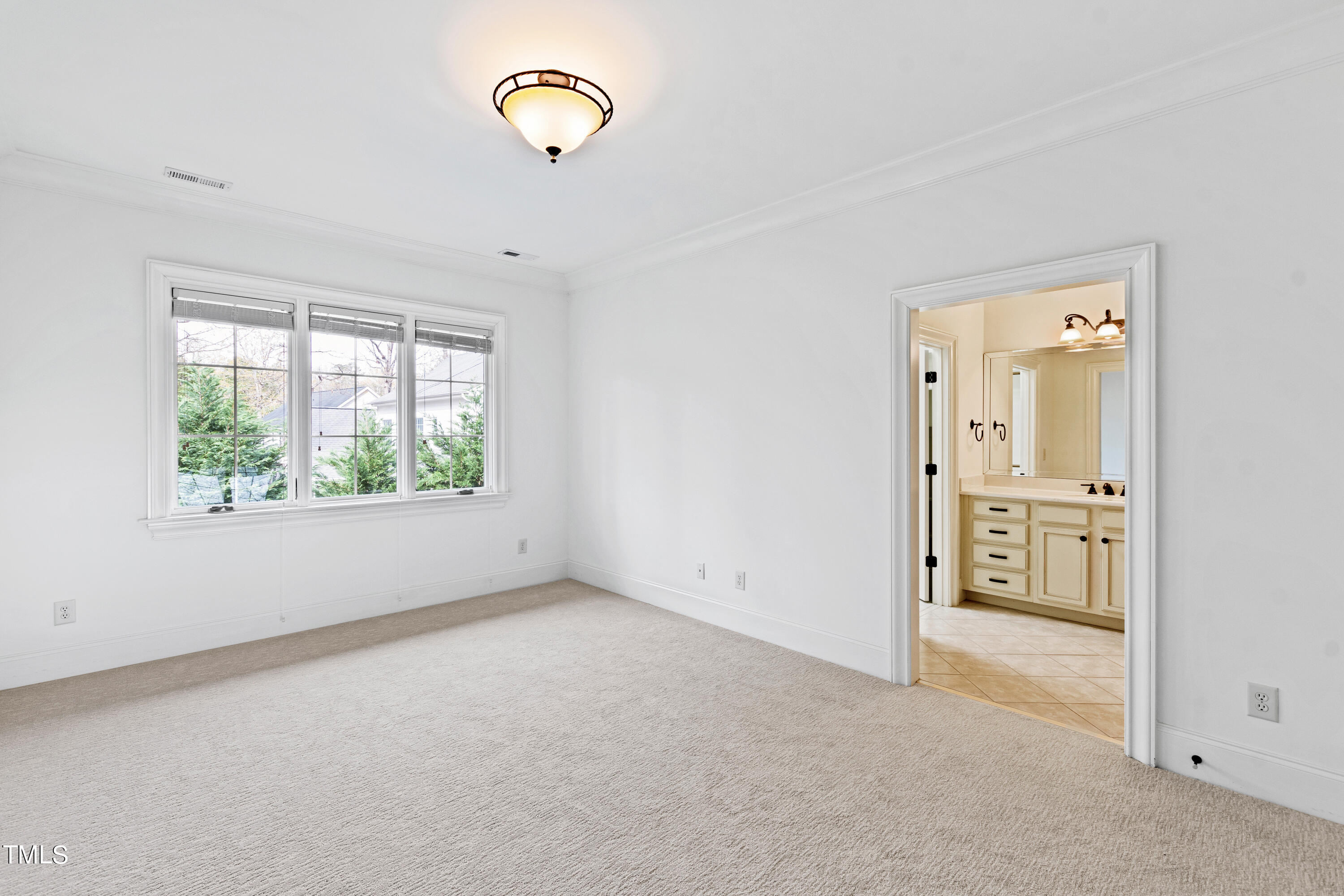 8108 Harps Mill Road Raleigh, NC 27615 - Photo 39 of 64 an empty room with windows and painted walls