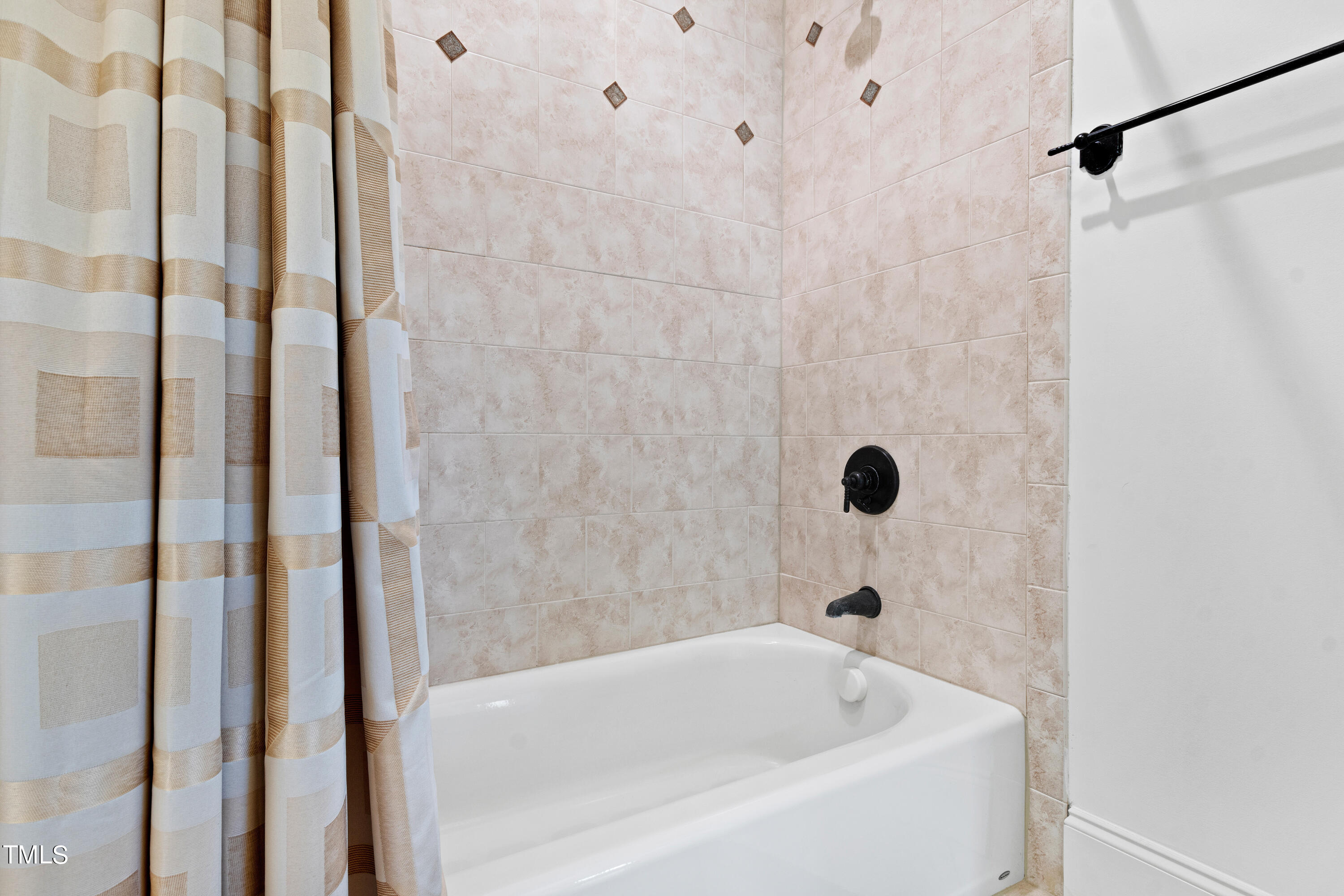 8108 Harps Mill Road Raleigh, NC 27615 - Photo 42 of 64 a bathroom with a bathtub