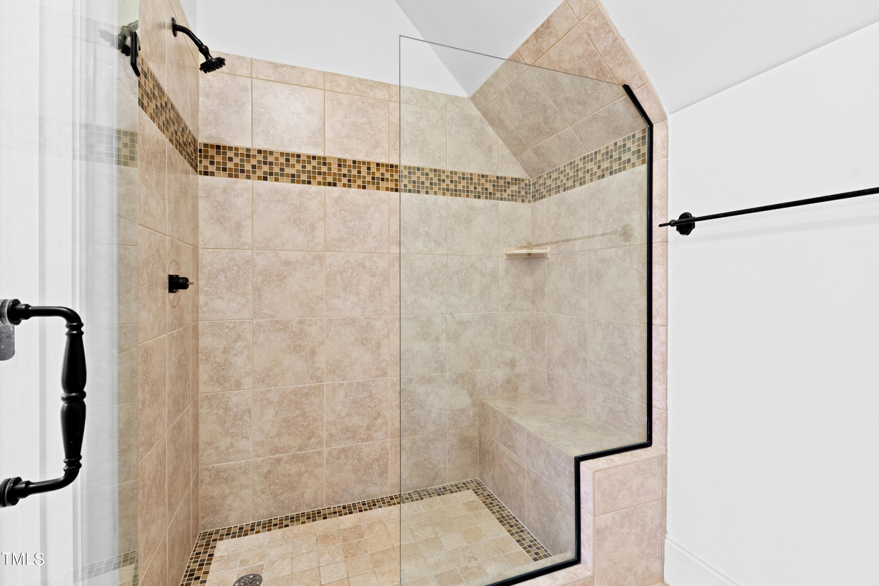 8108 Harps Mill Road Raleigh, NC 27615 - Photo 45 of 64 a bathroom with a shower