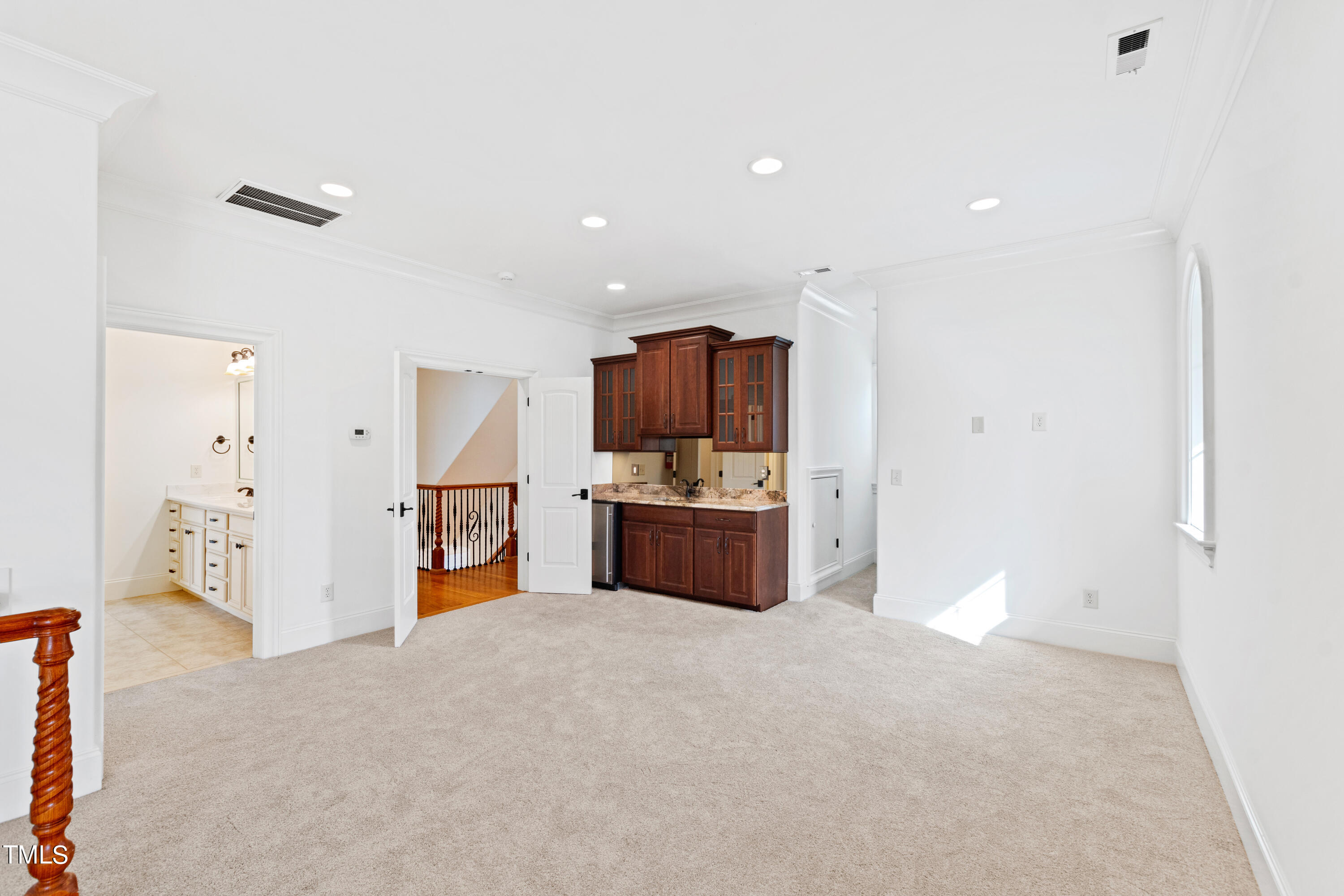 8108 Harps Mill Road Raleigh, NC 27615 - Photo 49 of 64 a large kitchen with a large counter top stainless steel appliances and cabinets