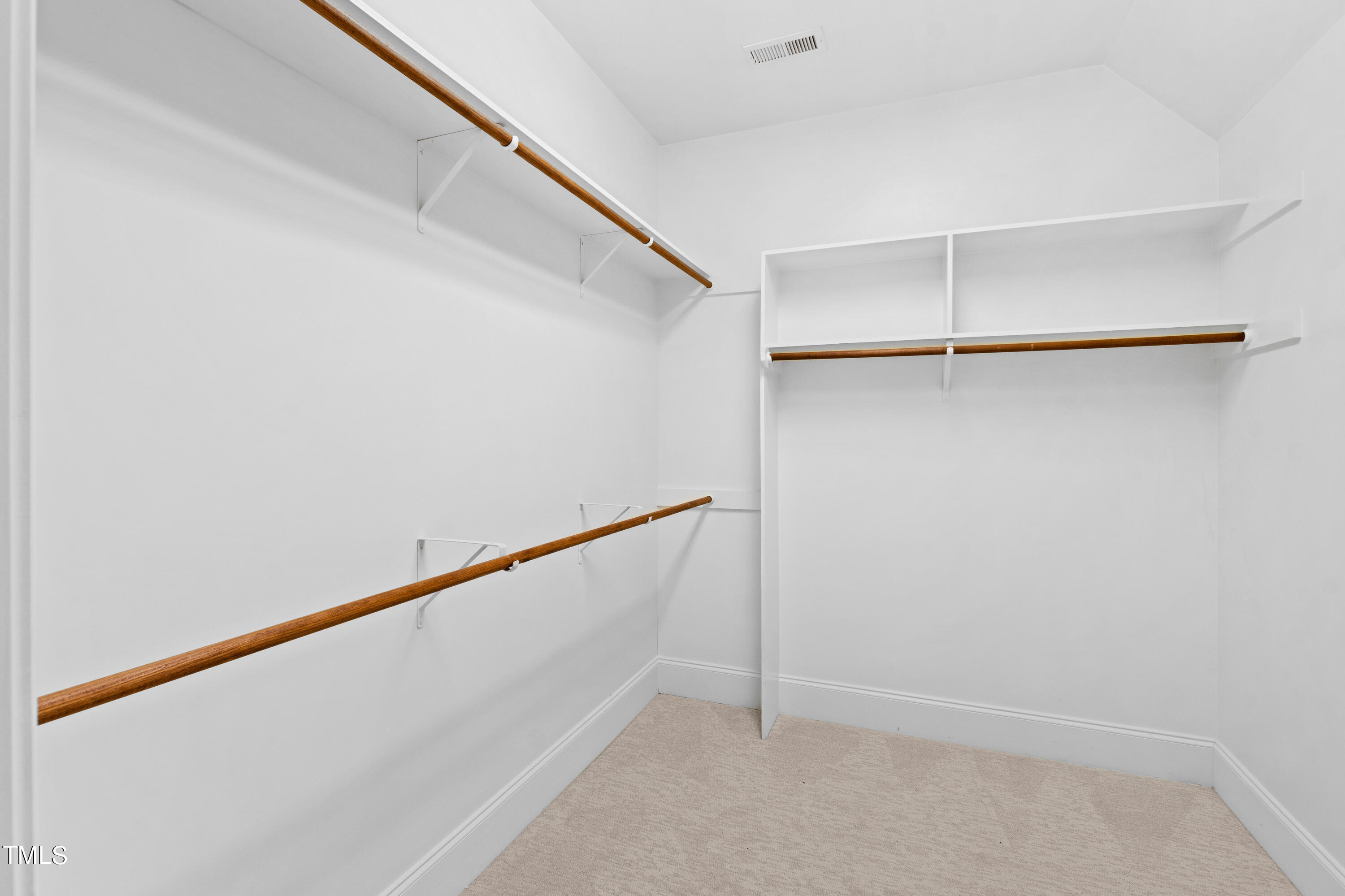 8108 Harps Mill Road Raleigh, NC 27615 - Photo 52 of 64 a view of an empty walk in closet