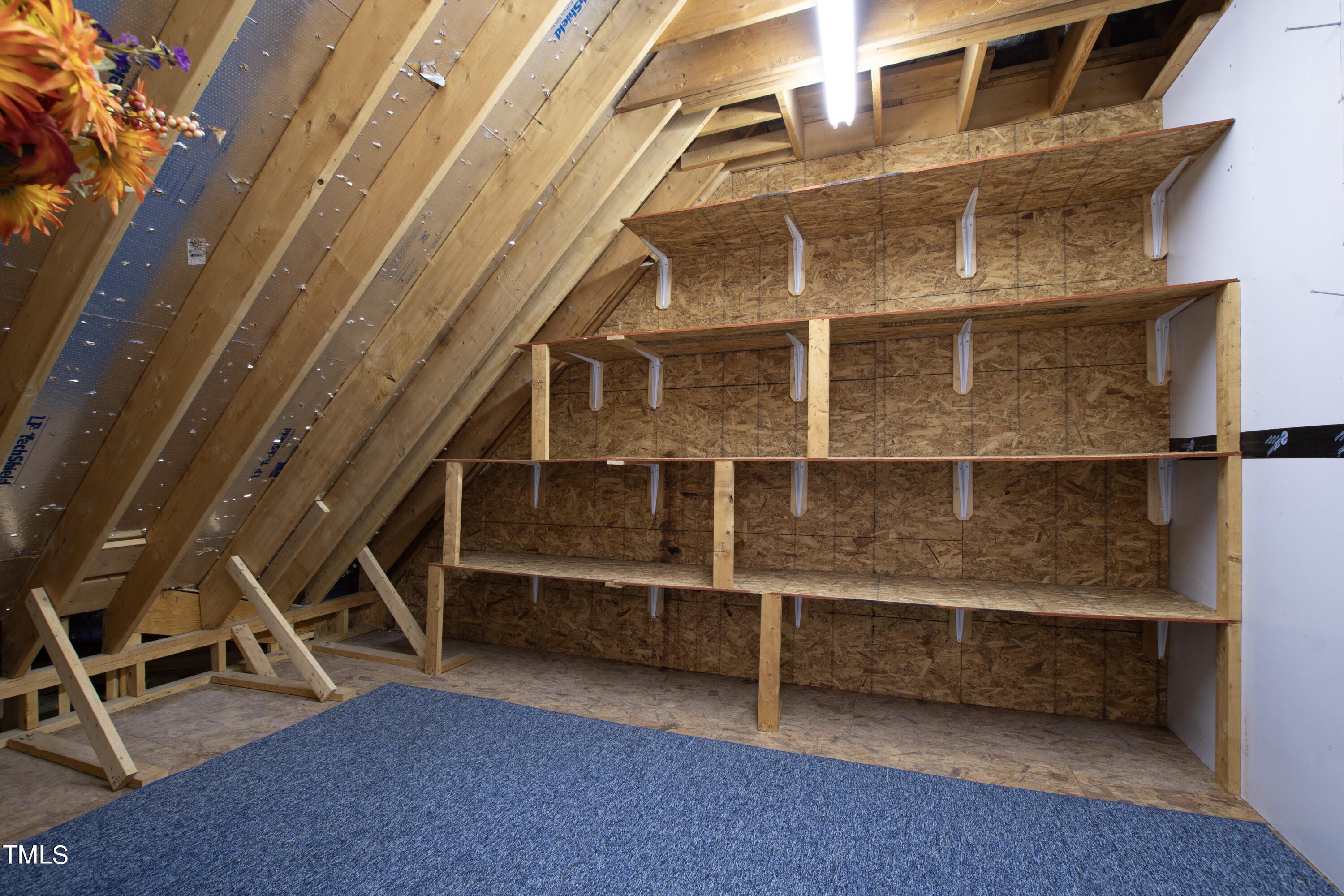 8108 Harps Mill Road Raleigh, NC 27615 - Photo 56 of 64 a view of an empty room with wooden floor and windows