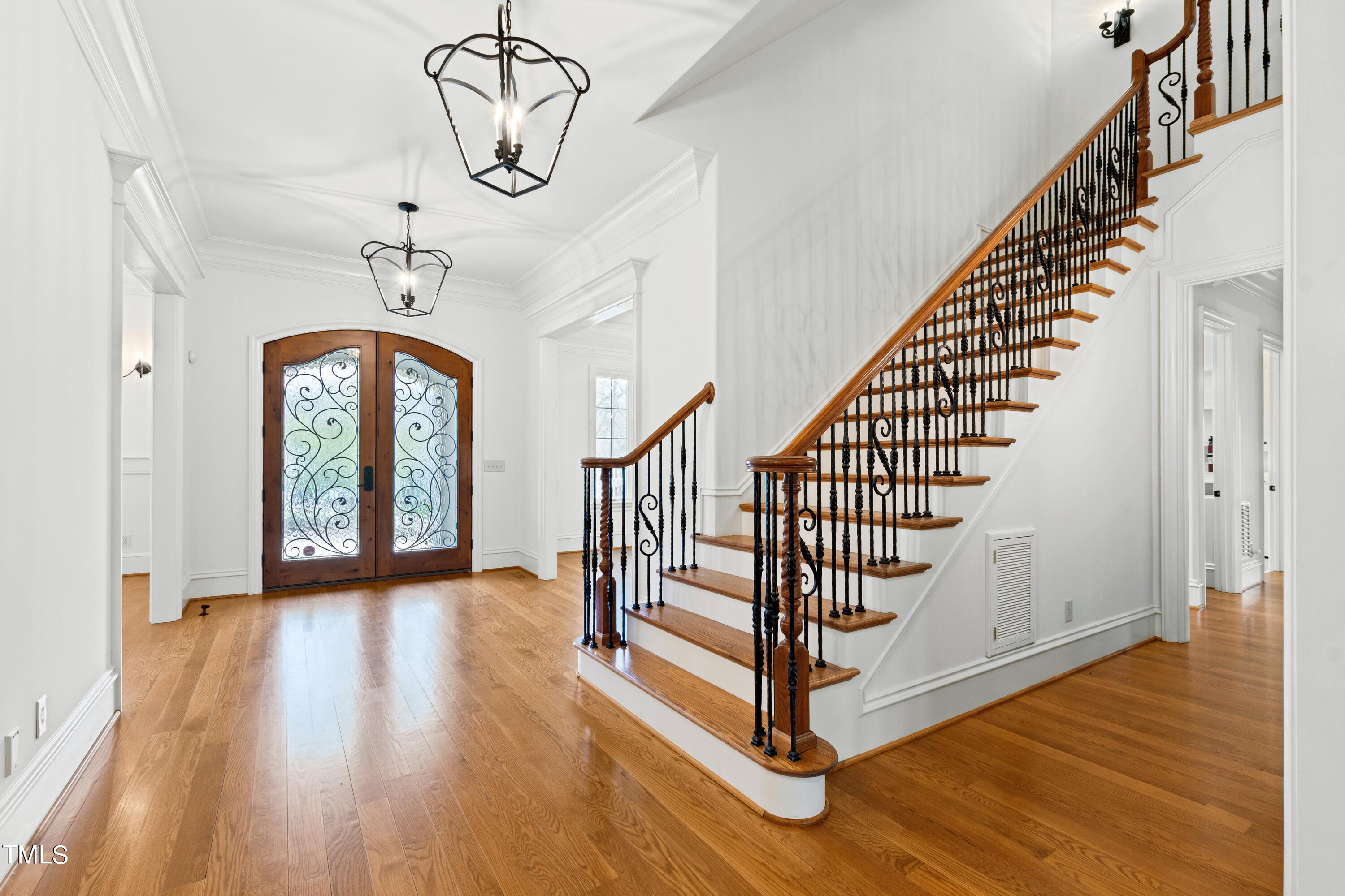 8108 Harps Mill Road Raleigh, NC 27615 - Photo 6 of 64 a view of entryway with wooden floor