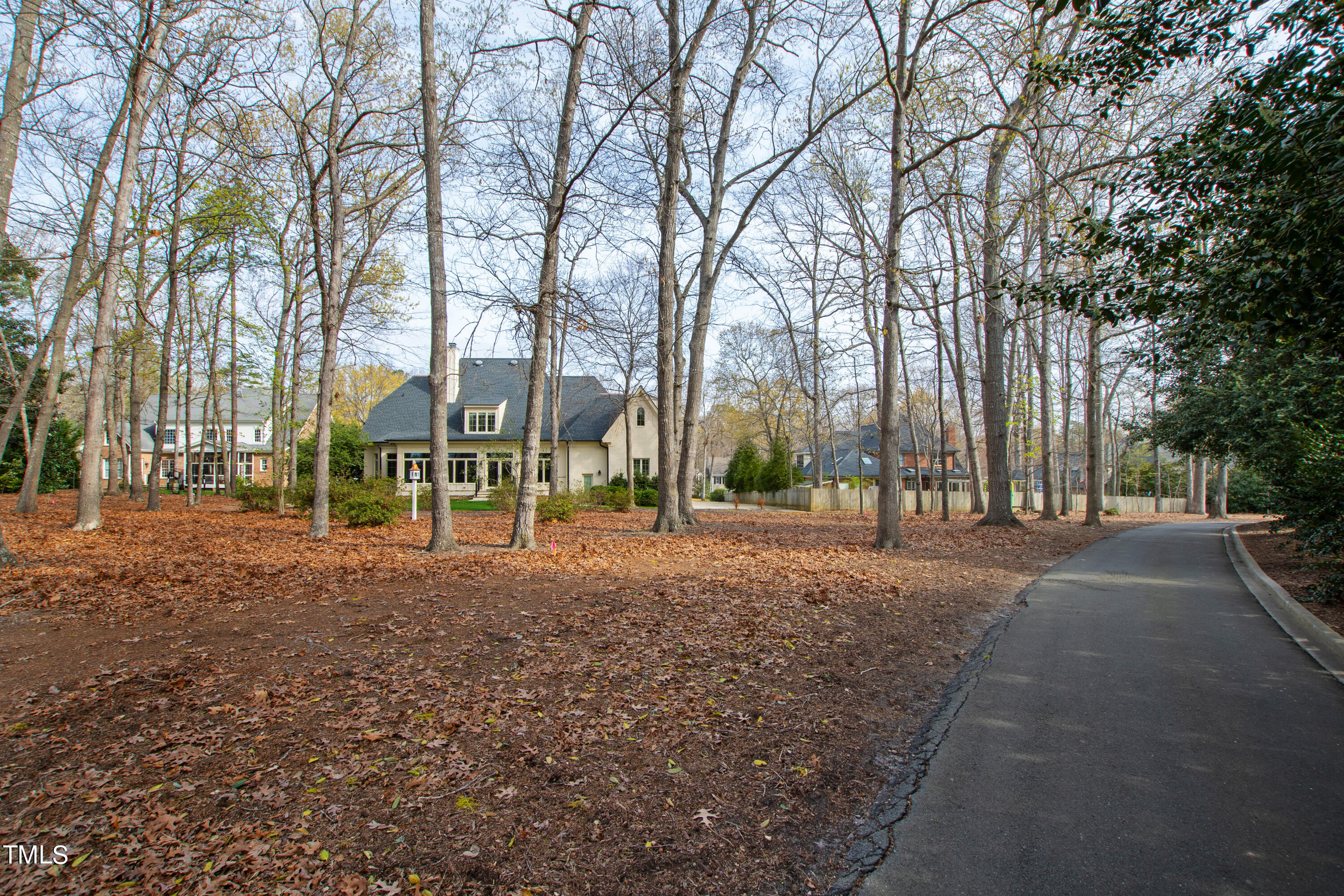 8108 Harps Mill Road Raleigh, NC 27615 - Photo 62 of 64 a view of road with trees
