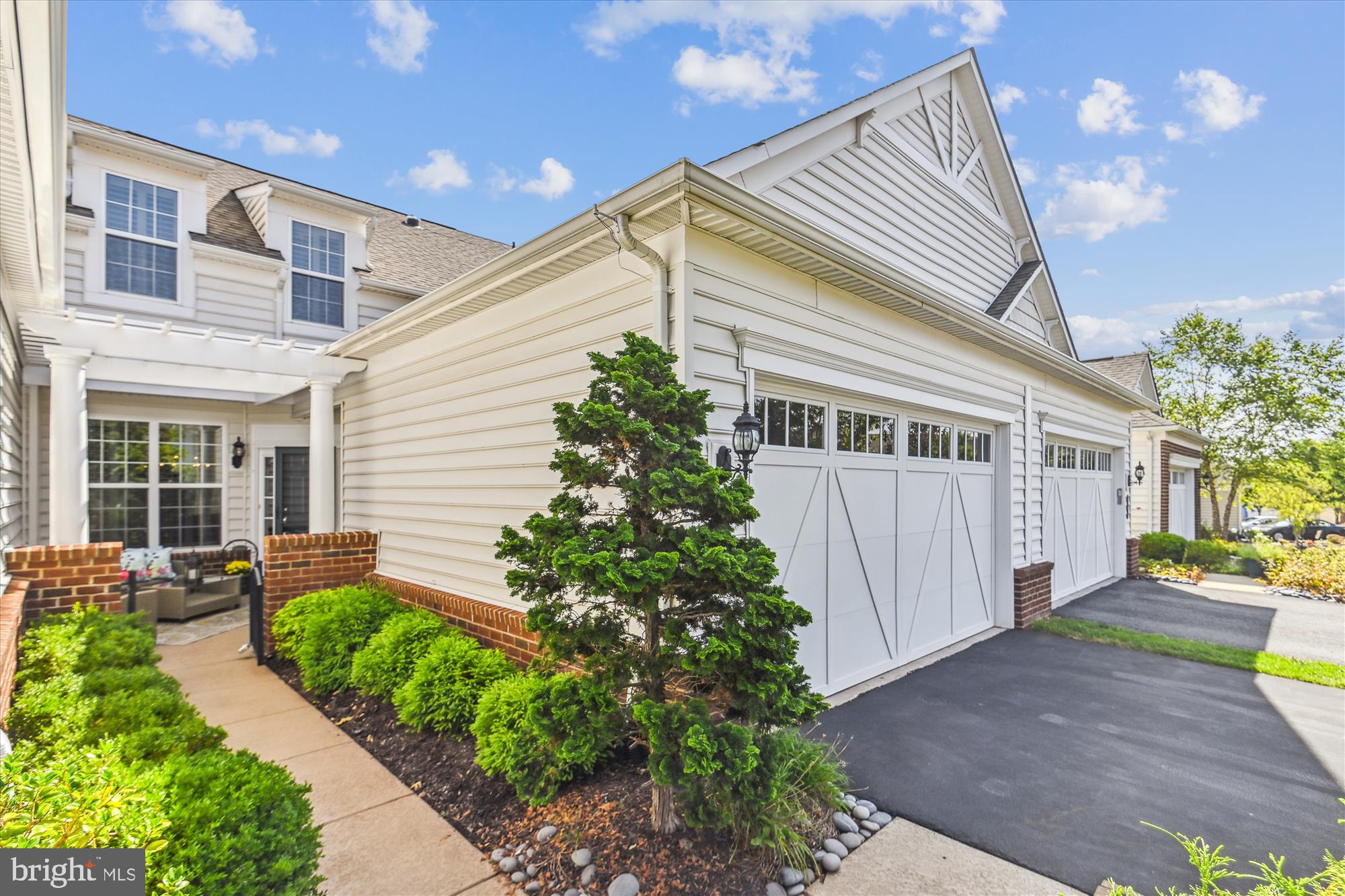 44440 Cruden Bay Drive Ashburn, VA 20147 - Photo 1 of 63 a front view of a house with a yard and potted plants