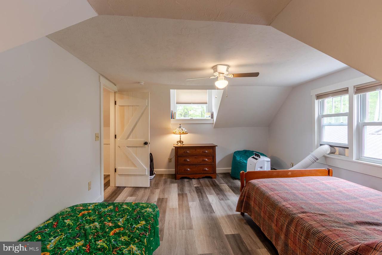 1834 Decker Hollow Road Tyrone, PA 16686 - Photo 32 of 40 a bedroom with a bed and a chandelier