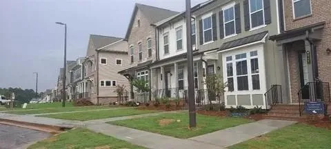 a view of a building with a yard