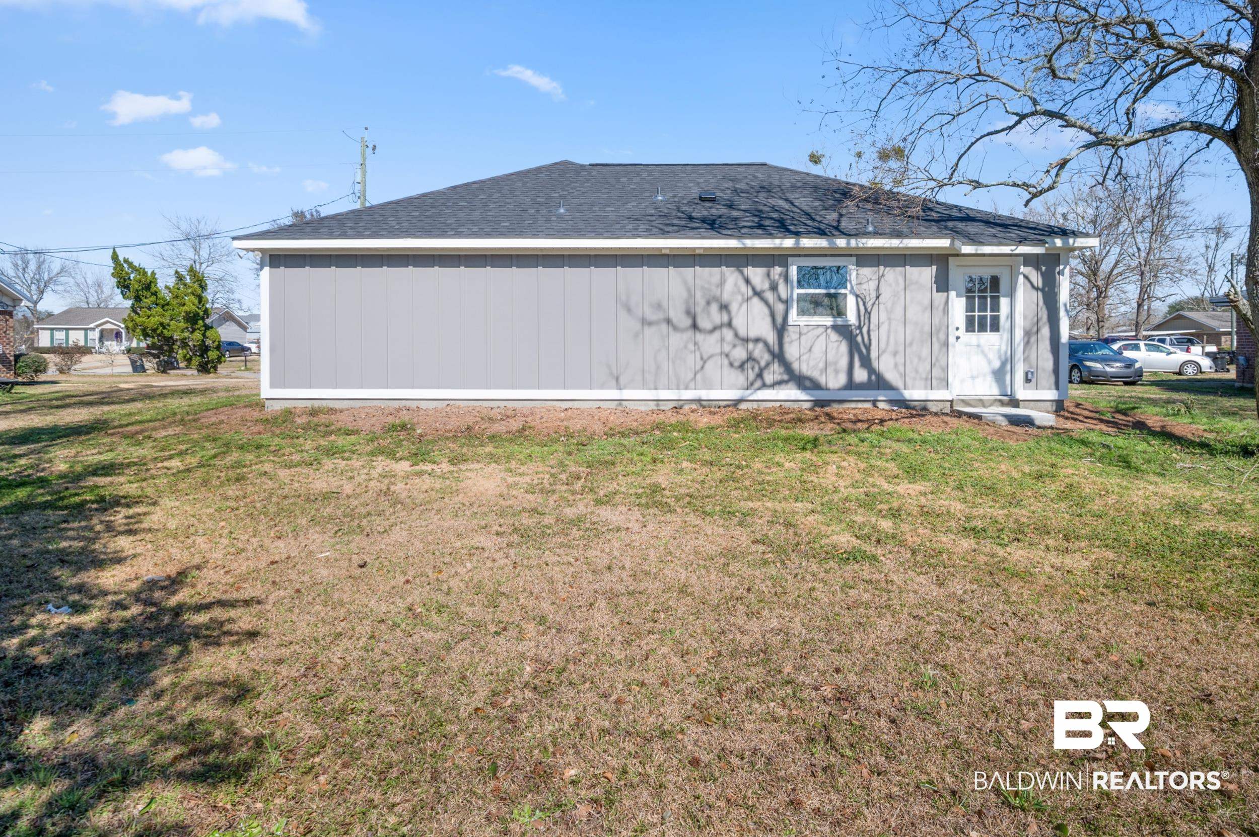 76 Fincher Lane Loxley, AL 36551 - Photo 27 of 33 Rear view of house with a lawn and roof with shingles