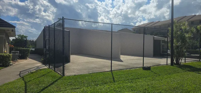 a view of a swimming pool with lounge chairs