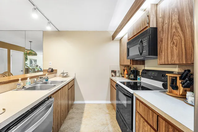 a kitchen with a stove and a microwave