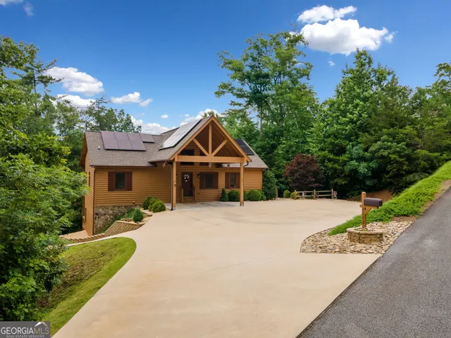 a front view of a house with yard