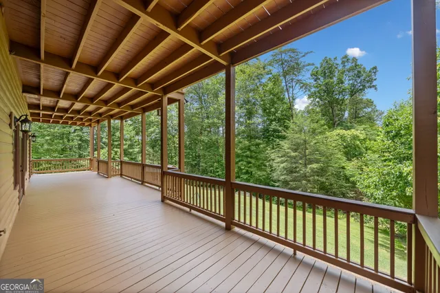 a view of a balcony with wooden floor
