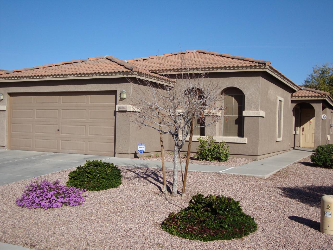 16160 West Calavar Road Surprise, AZ 85379 - Photo 1 of 4 a front view of a house