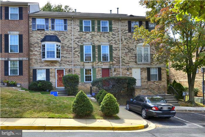 515 Pickwick Village Way Silver Spring, MD 20901 - Photo 1 of 20 a front view of a house with a yard