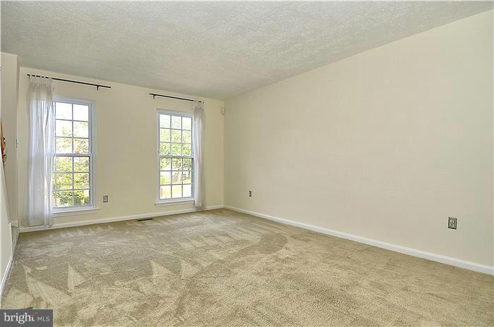 515 Pickwick Village Way Silver Spring, MD 20901 - Photo 11 of 20 an empty room with windows