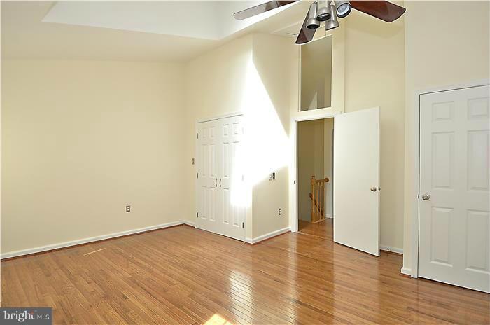 515 Pickwick Village Way Silver Spring, MD 20901 - Photo 13 of 20 a view of walk in closet with wooden floor