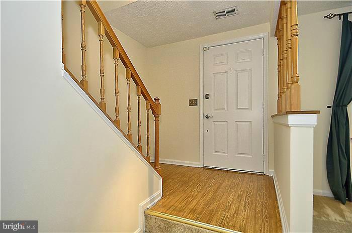 515 Pickwick Village Way Silver Spring, MD 20901 - Photo 3 of 20 a view of an entryway with wooden floor