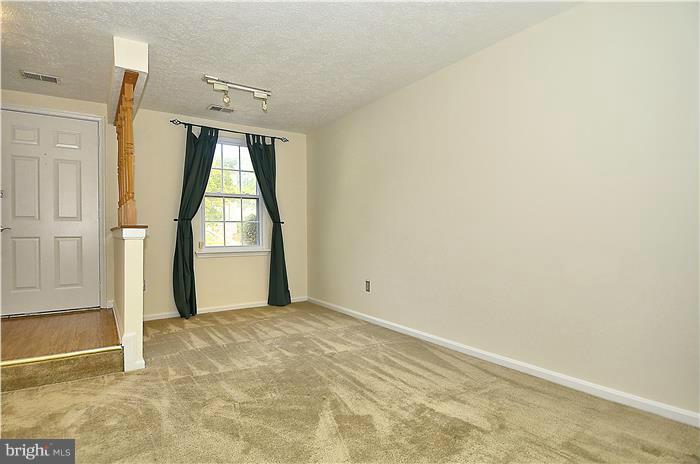 515 Pickwick Village Way Silver Spring, MD 20901 - Photo 4 of 20 an empty room with windows