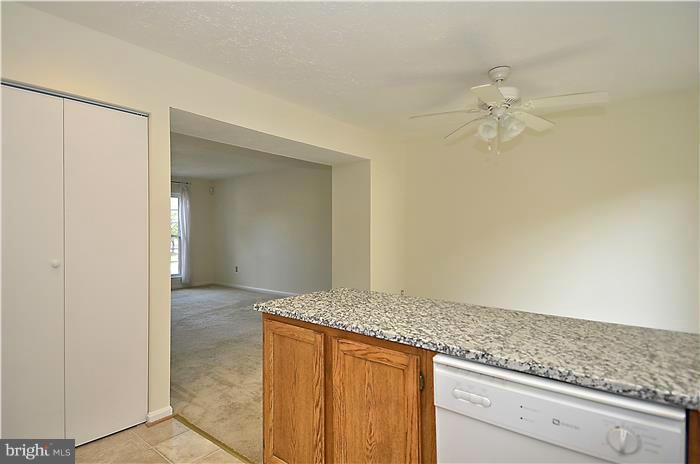 515 Pickwick Village Way Silver Spring, MD 20901 - Photo 8 of 20 a view of granite countertop cabinets and entryway