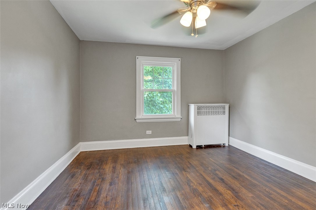 2972 Yorkshire Road Cleveland Heights, OH 44118 - Photo 24 of 44 Room featuring wood-finish flooring, light grey painted walls, and white trim