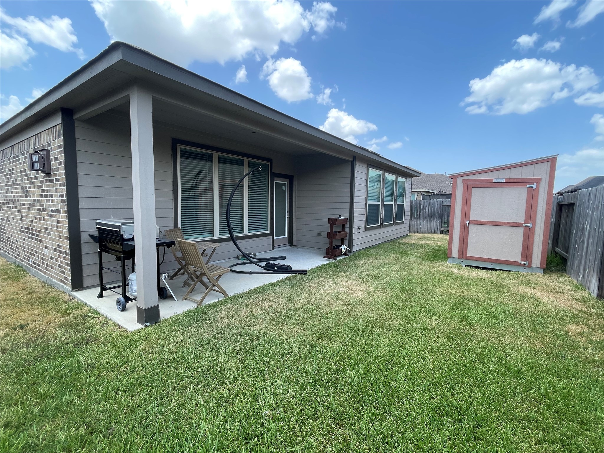 4118 Guild Meadows Drive Houston, TX 77084 - Photo 32 of 35 a view of a house with backyard porch and garden