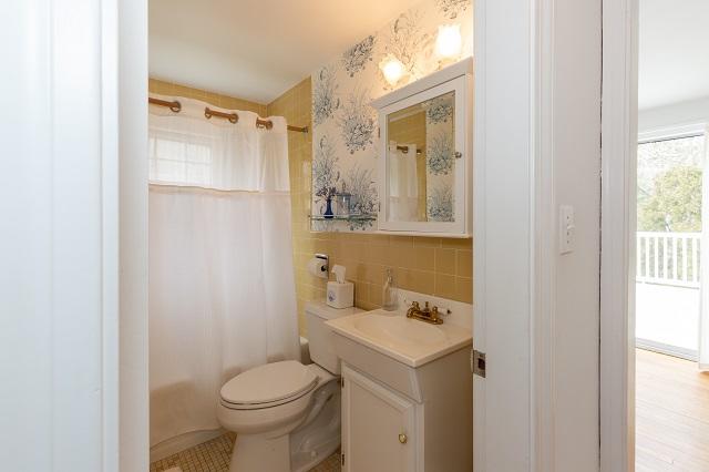 56 Nickerson Road Cotuit, MA 02635 - Photo 15 of 36 a bathroom with a sink toilet and shower