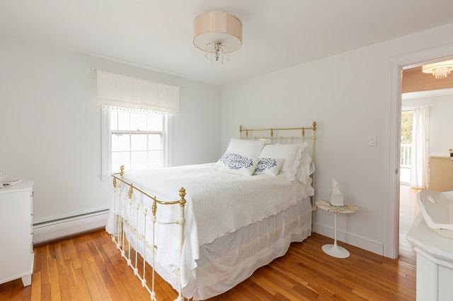 56 Nickerson Road Cotuit, MA 02635 - Photo 16 of 36 a bedroom with a bed and a window