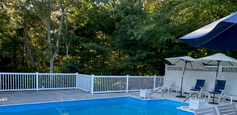 56 Nickerson Road Cotuit, MA 02635 - Photo 36 of 36 a view of a deck with furniture and wooden floor