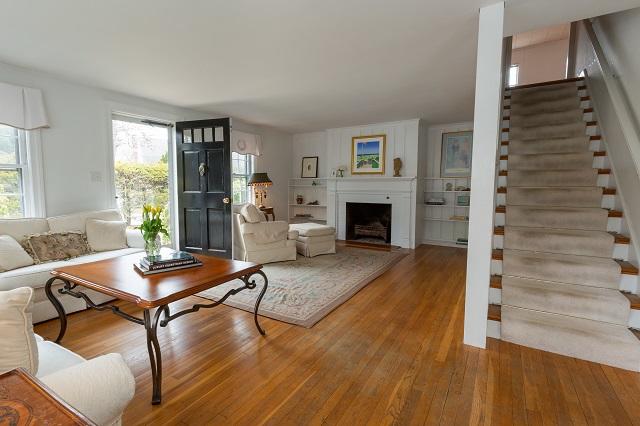 56 Nickerson Road Cotuit, MA 02635 - Photo 6 of 36 a living room with furniture and a fireplace