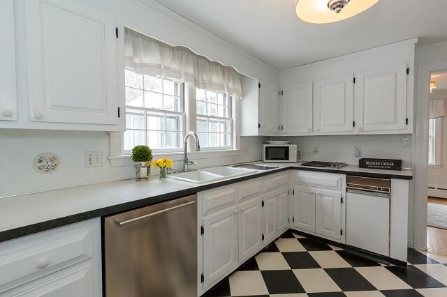 56 Nickerson Road Cotuit, MA 02635 - Photo 9 of 36 a kitchen with sink cabinets and window