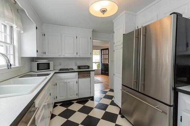 56 Nickerson Road Cotuit, MA 02635 - Photo 10 of 36 a kitchen with stainless steel appliances granite countertop a refrigerator and a sink