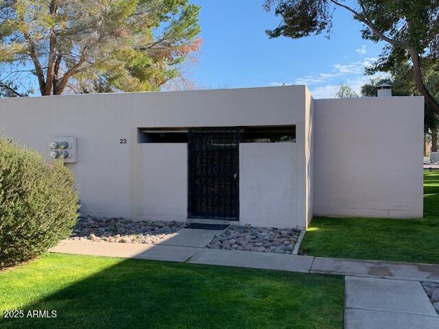 930 South Dobson Road, Unit 23 Mesa, AZ 85202 - Photo 1 of 13 a view of backyard with large trees